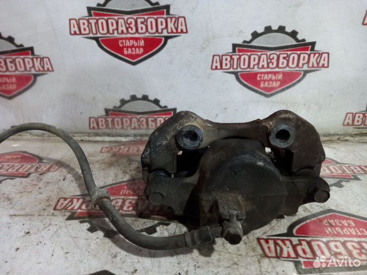 Суппорт тормозной передний левый Nissan Atlas