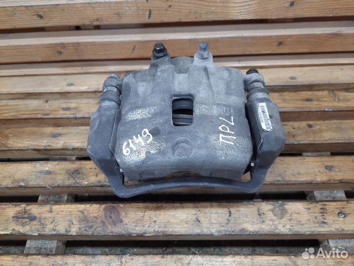 Суппорт тормозной передний левый Opel Astra J 2012