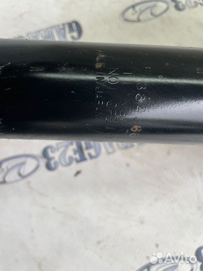 Стойка амортизатора Mitsubishi Outlander 1