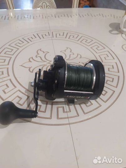 Катушка рыболовная инерционная