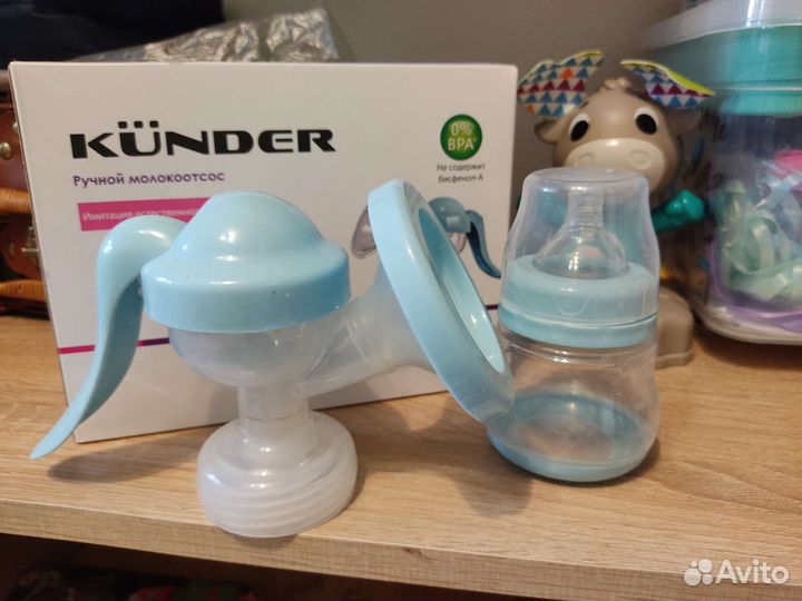 Молокоотсос kunder и накладка на грудь medela