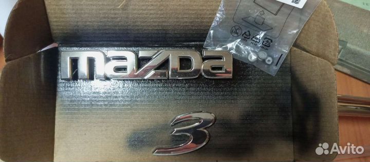 Эмблема mazda 3 bk