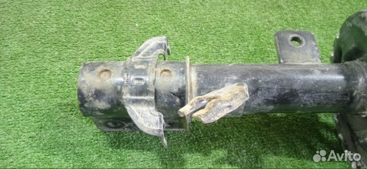 Амортизатор передний левый Nissan Micra K12E