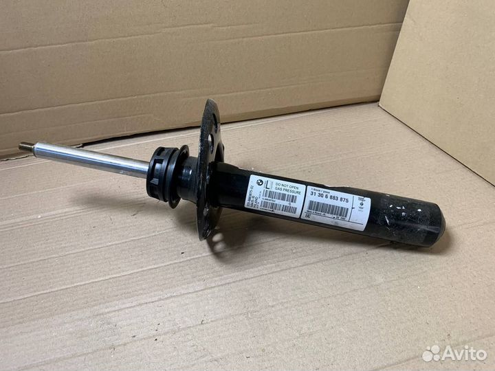 Стойка амортизатора передняя левая BMW F44