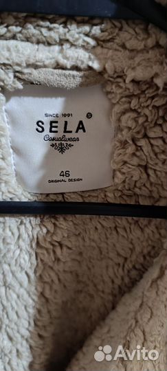 Жилетка меховая женская