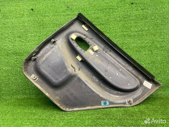 Обшивка двери задняя левая Kia Spectra