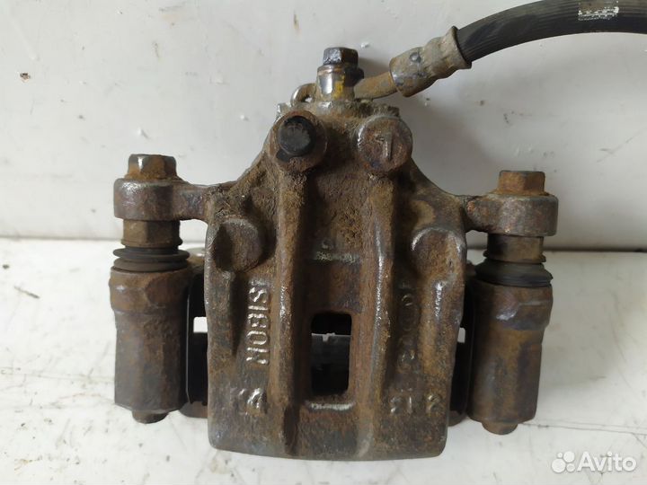 Суппорт тормозной задний левый ix35/Tucson 2010