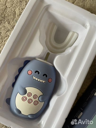 Электрическая зубная щетка