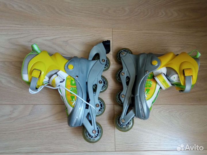 Роликовые коньки женские раздвижные с защитой