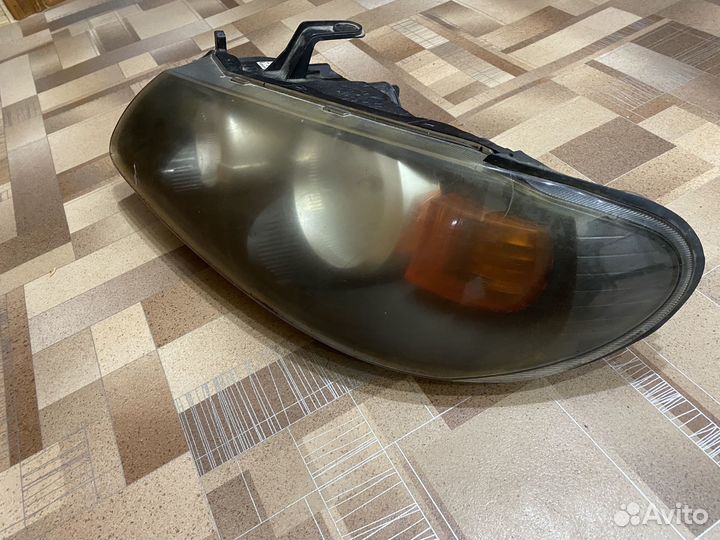 Фара левая Nissan Almera