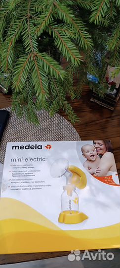 Молокоотсос medela электрический