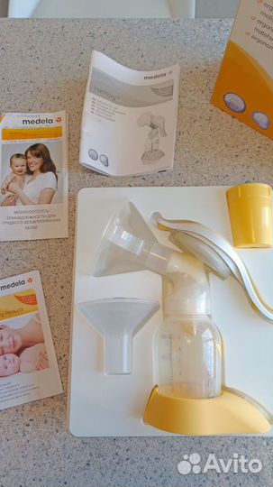 Молокоотсос medela ручной + бутылочки avent