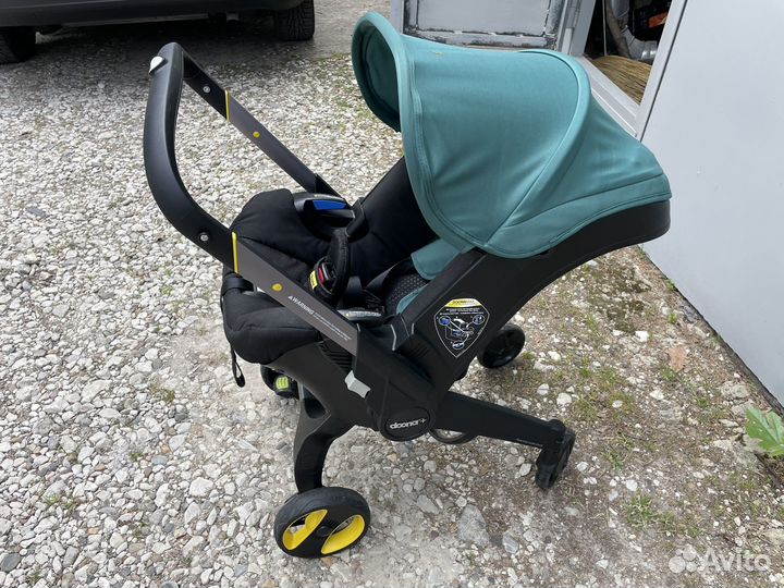 Коляска автокресло doona с базой isofix