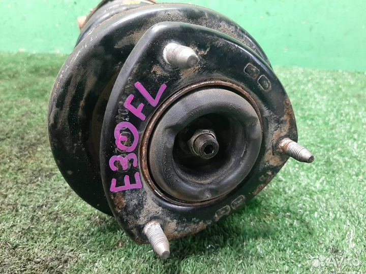 Стойка амортизатора передняя левая Suzuki Grand V