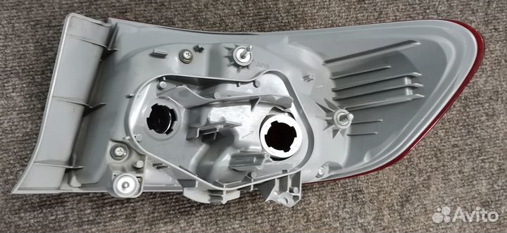 Фонарь левый внешний Toyota Corolla E150