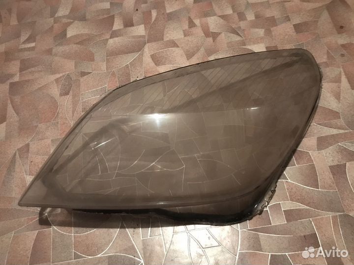 Стекло фары Opel Astra H