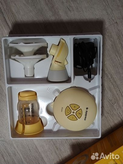 Молокоотсос medela электрический