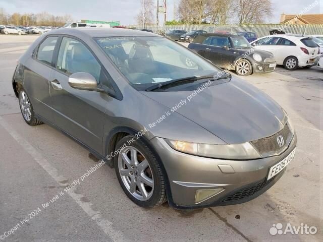 Форсунка омывателя фар передняя левая Honda Civic