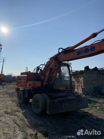 Колёсный экскаватор Hitachi EX165W, 2002