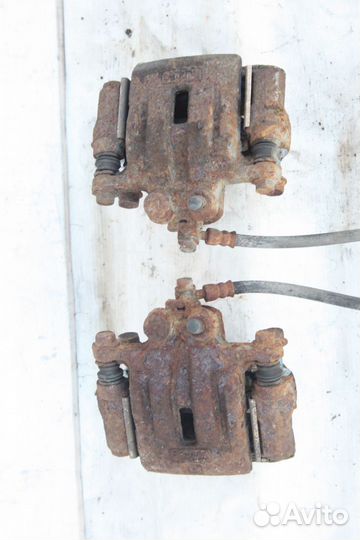 Суппорт тормозной задний левый Mazda CX7