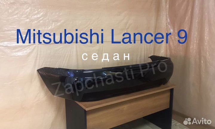 Задний бампер на Mitsubishi Lancer 9 черный 2009
