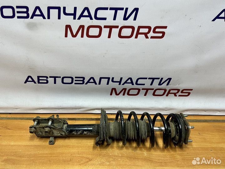 Mazda CX-7 передняя стойка амортизатора левая