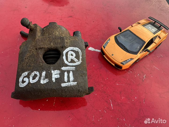 Суппорт тормозной VW Golf 2 передний правый