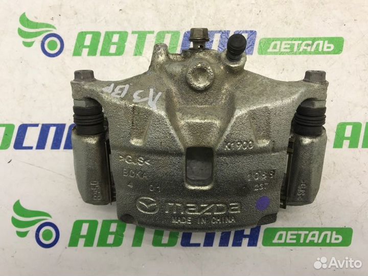 Суппорт тормозной передний левый Mazda 3 BP PE