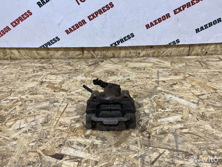 Суппорт тормозной задний левый Skoda Octavia A5