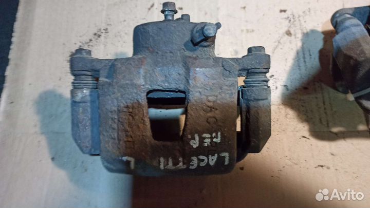 Суппорт тормозной передний Chevrolet Lacetti