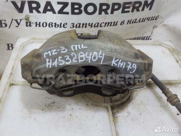 Суппорт тормозной передний левый Mazda 3