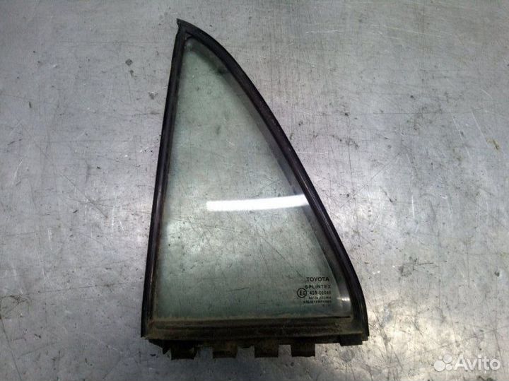 Стекло двери заднее левое Toyota Corolla E12 1.4