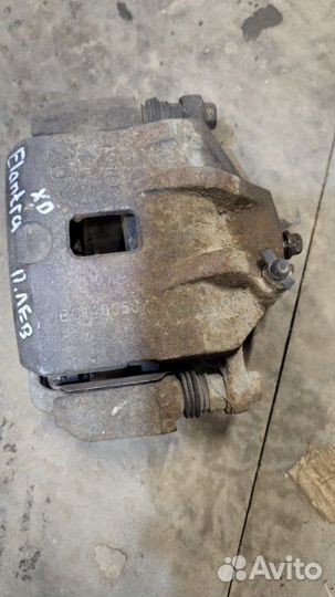 Суппорт тормозной передний левый Hyundai Elantra