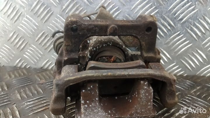 Суппорт тормозной задний левый citroen C4 picasso 1 2008