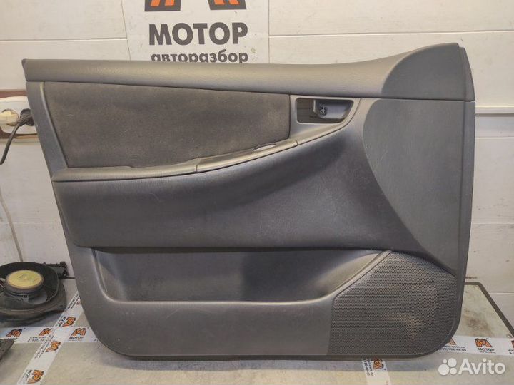 Обшивка двери передняя левая Toyota Corolla E12