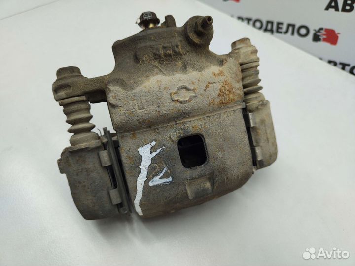 Суппорт тормозной левый Nissan Lucino N15 1995 г