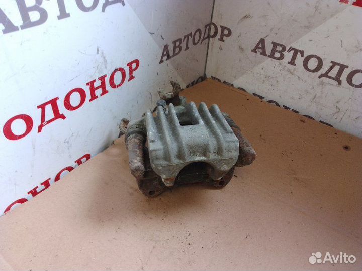 Суппорт тормозной задний левый Volkswagen Passat