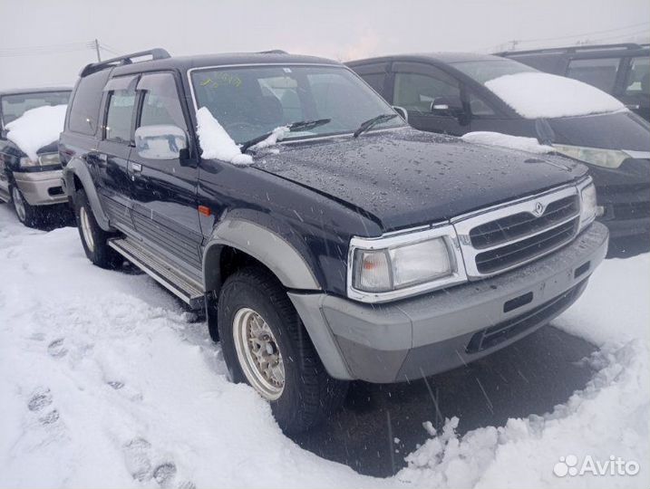 Амортизатор/стойка задняя левая Mazda Proceed Marvie