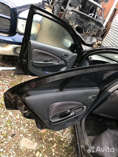 Двери nissan almera н16