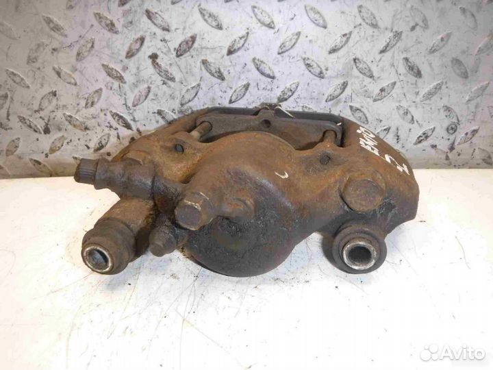 Суппорт тормозной передний левый Mazda Demio