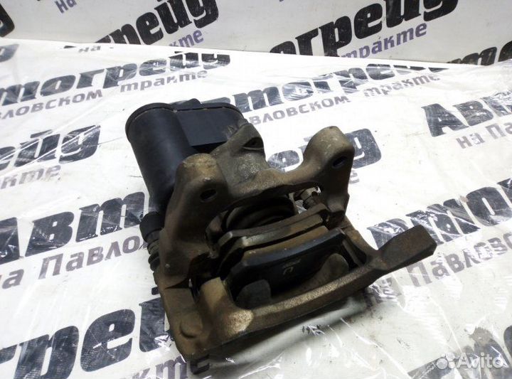 Суппорт тормозной задний левый Volkswagen Tiguan