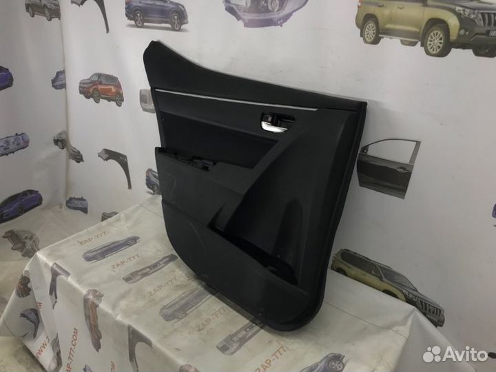 Обшивка двери задняя левая Toyota Corolla E180