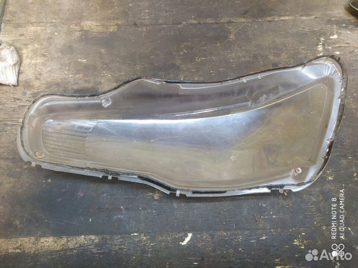 Стекло фары правой Mitsubishi Lancer 10