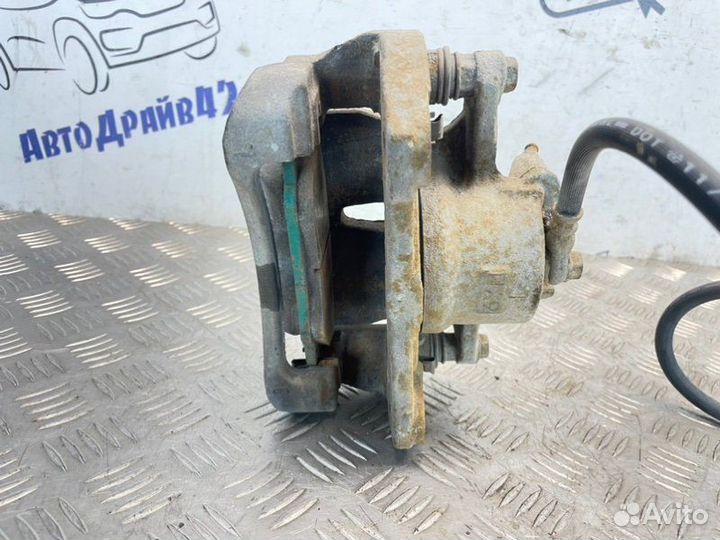 Суппорт тормозной передний левый Toyota Corolla