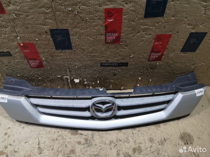 Решетка радиатора на Mazda Demio DW3W