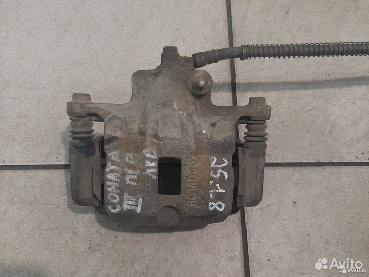 Тормозной суппорт передний левый Hyundai Sonata 3