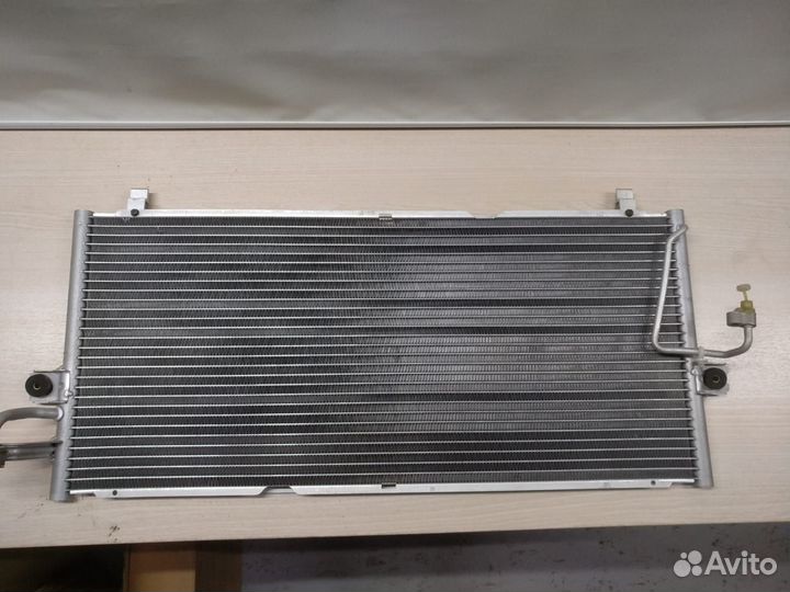 Радиатор кондиционера Nissan Primera 921109F515