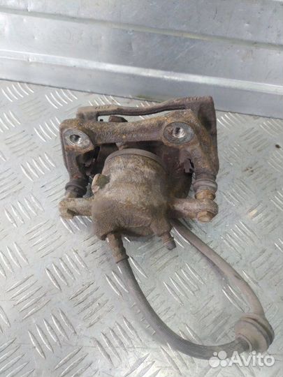 Суппорт тормозной передний левый Renault Duster