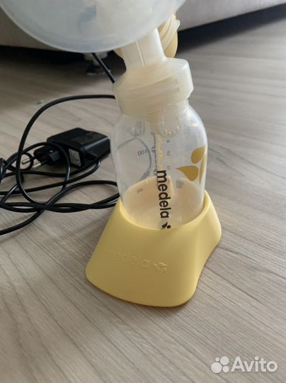 Молокоотсос medela электрический
