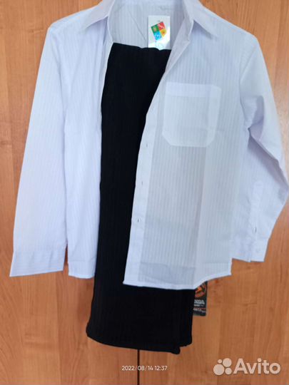 Новые брюки и рубашка на мальчика